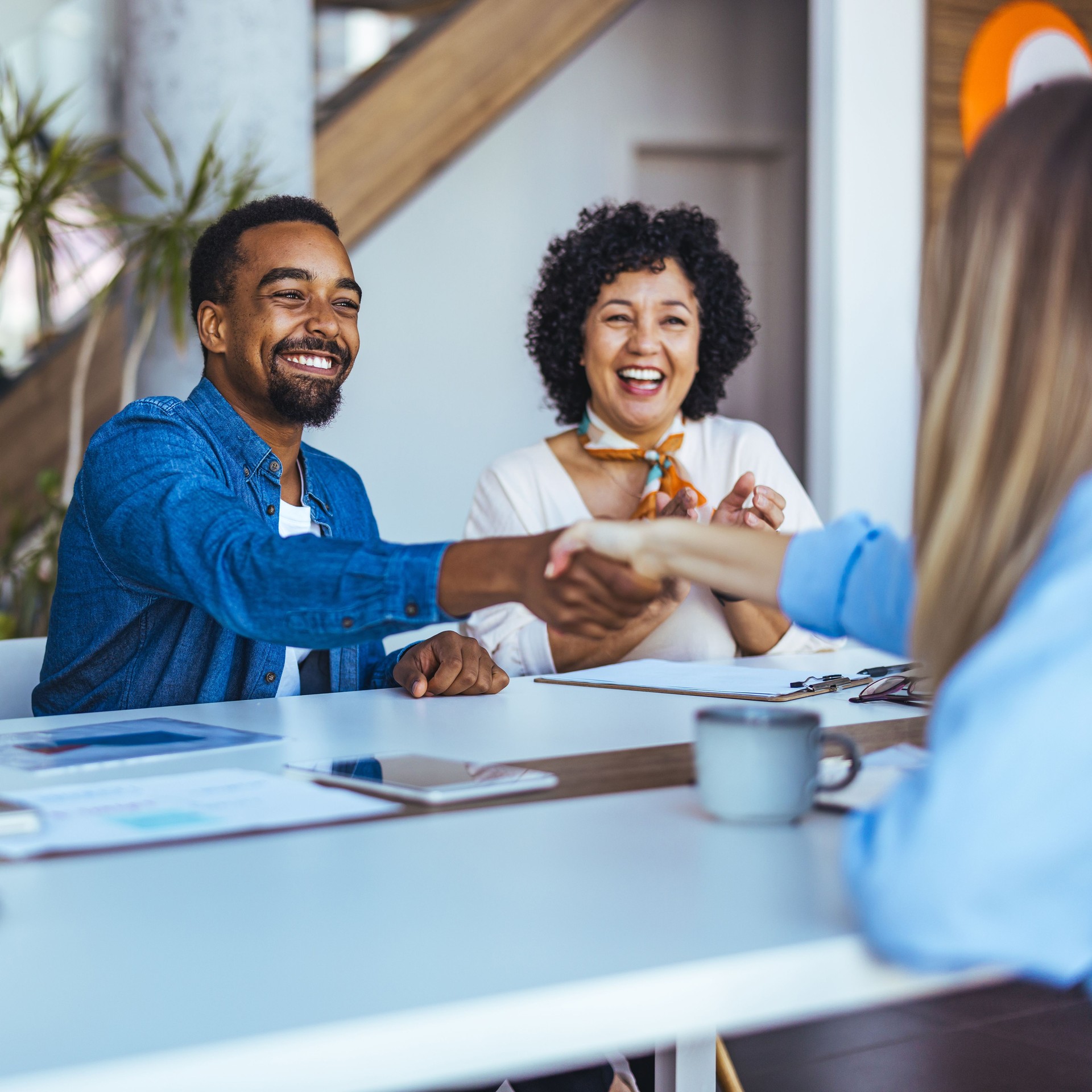 Smiling Professionals Shaking Hands During a Successful Business Meeting